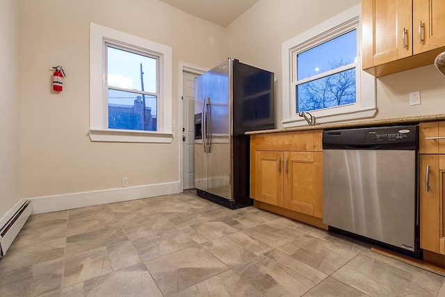 kitchen with baseboard heating and stainless steel appliances