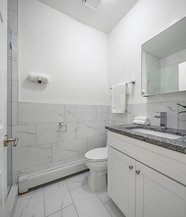 110 Washington St Unit 8, Hoboken, NJ 07030 - full bathroom featuring marble finish flooring, vanity, a baseboard radiator, tile walls, and a wainscoted wall
