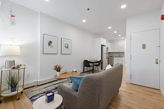 110 Washington St Unit 8, Hoboken, NJ 07030 - living area with recessed lighting and light wood-type flooring