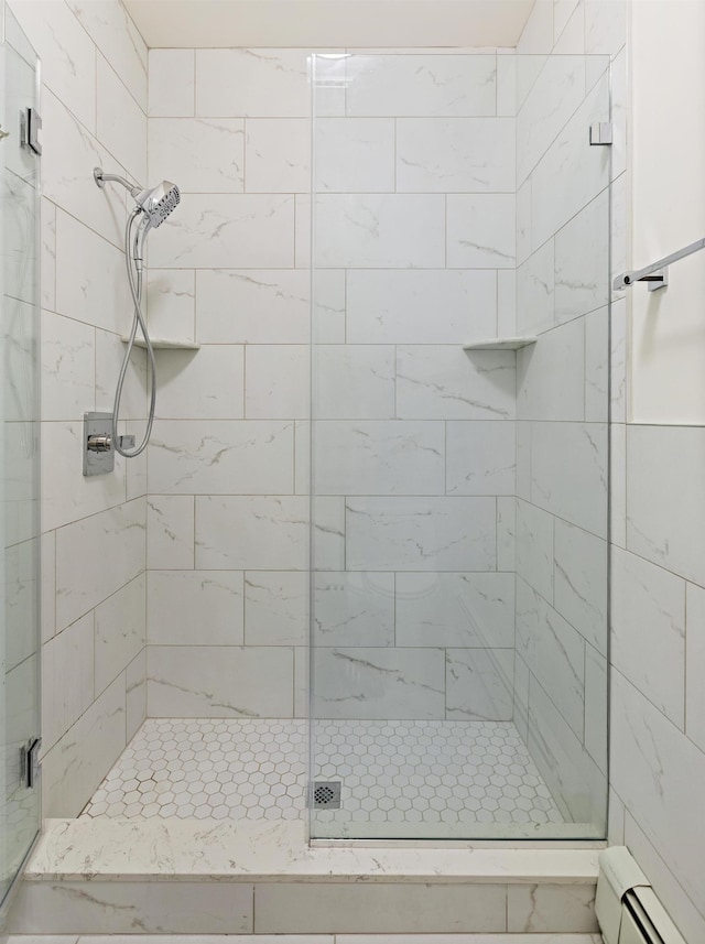 110 Washington St Unit 8, Hoboken, NJ 07030 - bathroom with a shower stall and baseboard heating