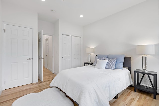 110 Washington St Unit 8, Hoboken, NJ 07030 - bedroom with light wood finished floors, a closet, and recessed lighting