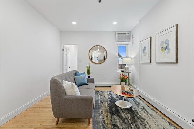 110 Washington St Unit 8, Hoboken, NJ 07030 - living area featuring light wood finished floors, a wall mounted air conditioner, recessed lighting, and a baseboard heating unit