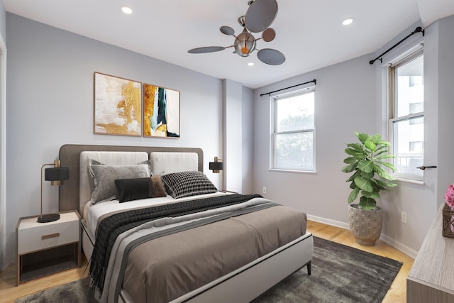 bedroom with hardwood / wood-style flooring and ceiling fan