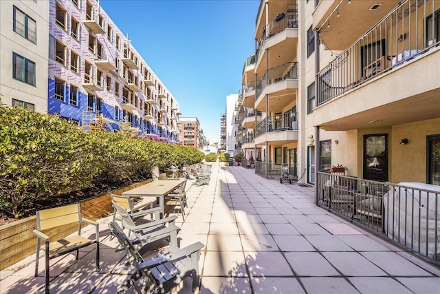 view of home's community featuring a patio area