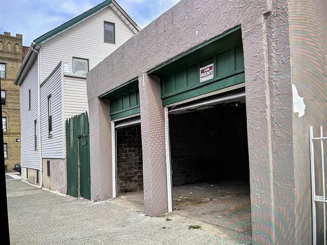 149 37th St, Union City, NJ 07087 - view of side of home with an attached garage