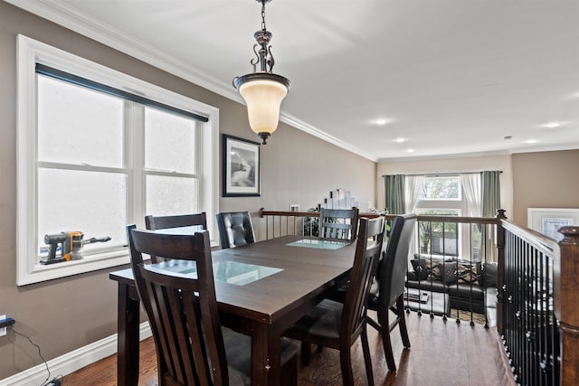 dining area with crown molding, recessed lighting, baseboards, and wood finished floors