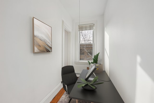 office space with wood-type flooring