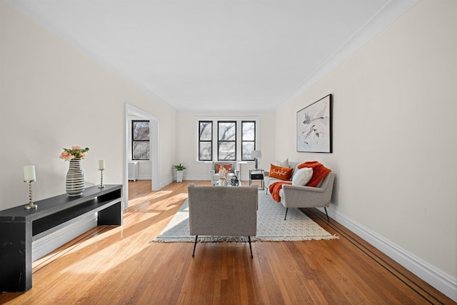 living room featuring wood finished floors and baseboards