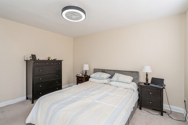 bedroom featuring carpet flooring and baseboards