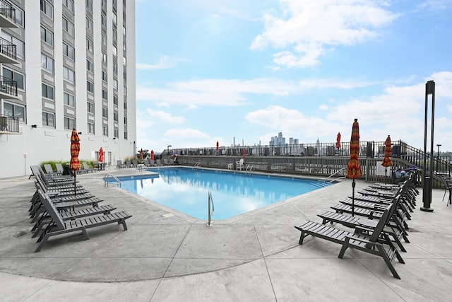 view of pool featuring a patio