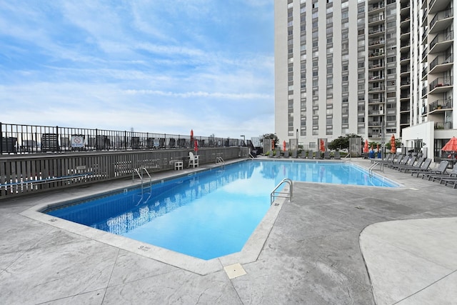 view of swimming pool featuring a patio area