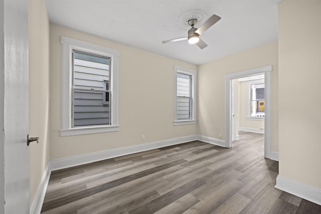 45 New St, Jersey City, NJ 07305 - empty room featuring wood finished floors, ceiling fan, and baseboards