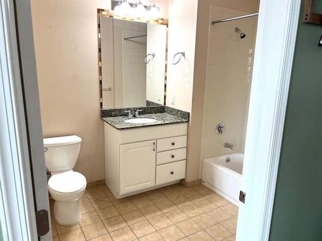 full bathroom with vanity, tiled shower / bath, tile patterned floors, and toilet