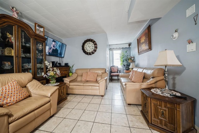 living room with light tile patterned floors