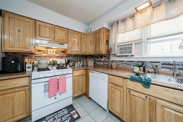 kitchen featuring cooling unit, backsplash, light tile patterned floors, sink, and white appliances