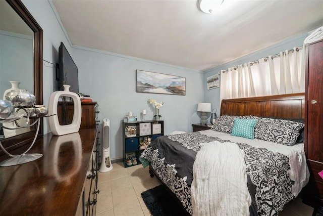 bedroom featuring light tile patterned flooring and ornamental molding