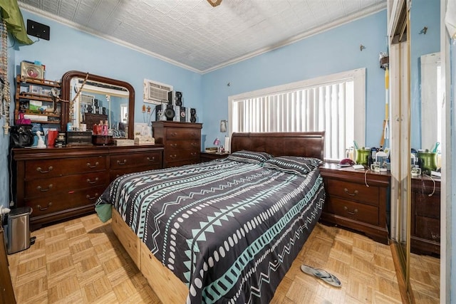 bedroom with ornamental molding, light parquet floors, and a wall mounted AC