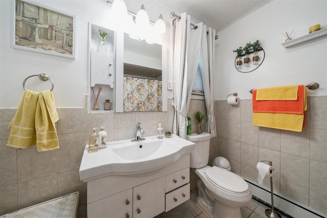 bathroom featuring tile walls, vanity, tile patterned flooring, a baseboard heating unit, and toilet