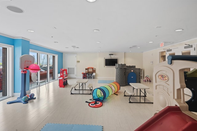 game room featuring wood finished floors, recessed lighting, and baseboards