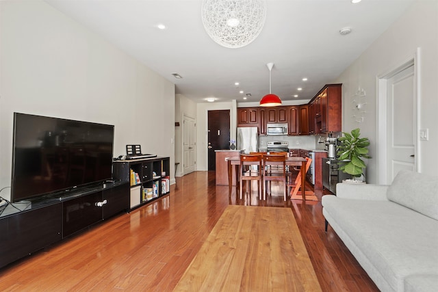 living room featuring recessed lighting and light wood-style floors