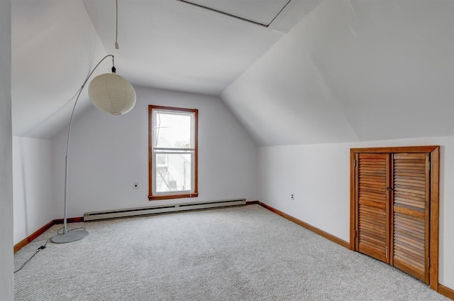 bonus room with a baseboard radiator, baseboards, lofted ceiling, and carpet flooring