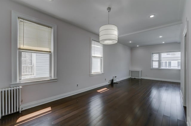 unfurnished room featuring recessed lighting, radiator, baseboards, and dark wood-style flooring