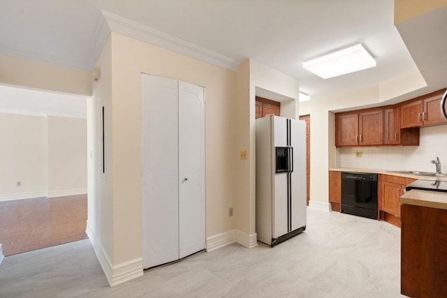 kitchen with dishwasher, light countertops, brown cabinets, white fridge with ice dispenser, and a sink