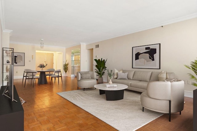 living room with crown molding, baseboards, and visible vents