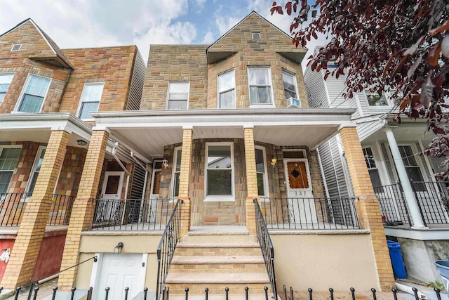 multi unit property featuring a porch