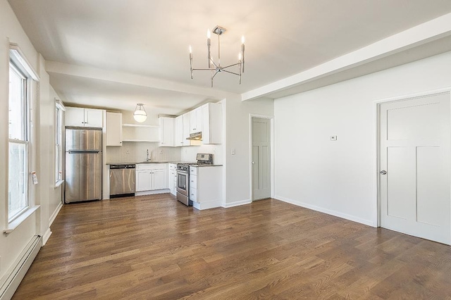 kitchen with white cabinetry, sink, stainless steel appliances, a notable chandelier, and a baseboard heating unit