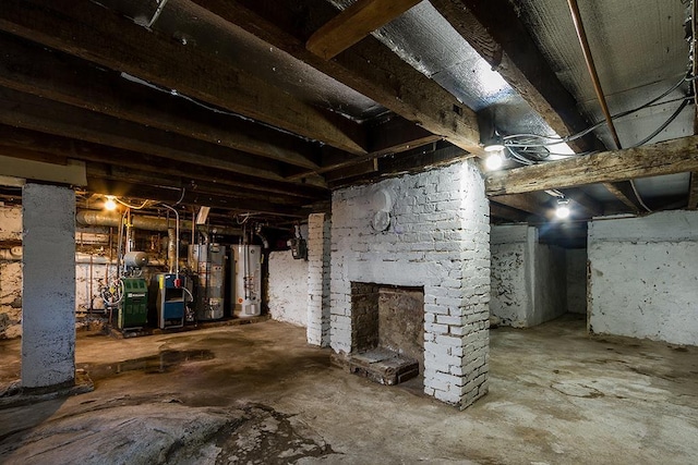 basement with gas water heater and a fireplace