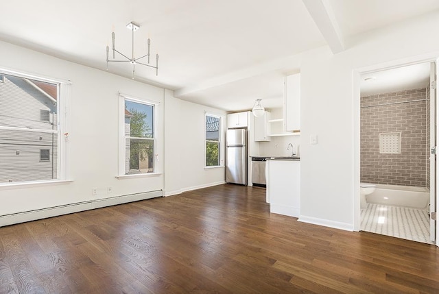 unfurnished living room with dark hardwood / wood-style flooring, a notable chandelier, and a baseboard heating unit