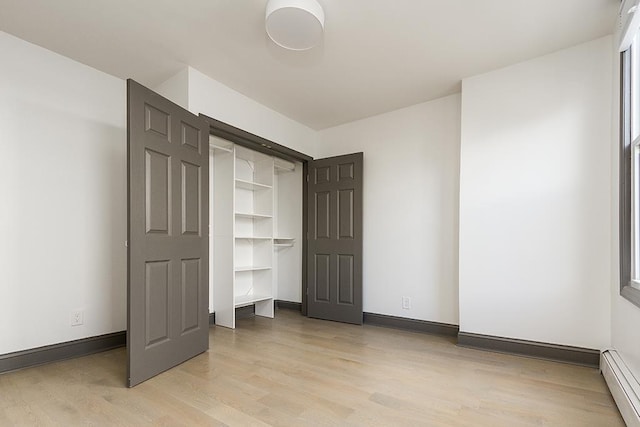 closet featuring baseboard heating