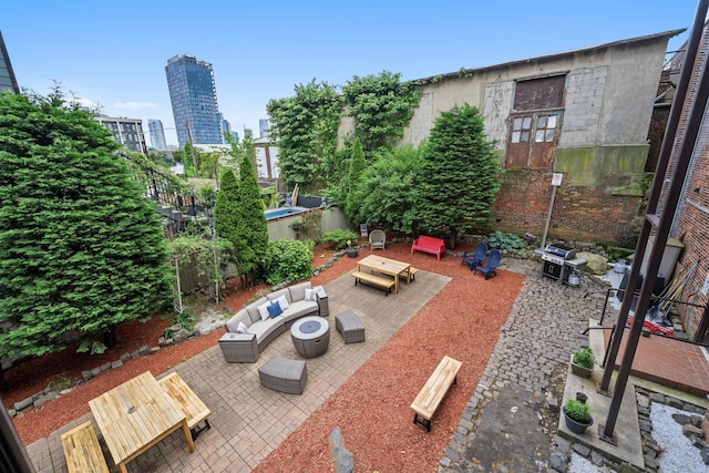 300 Communipaw Ave Unit 11, Jersey City, NJ 07304 - view of patio with an outdoor hangout area, a city view, and a grill
