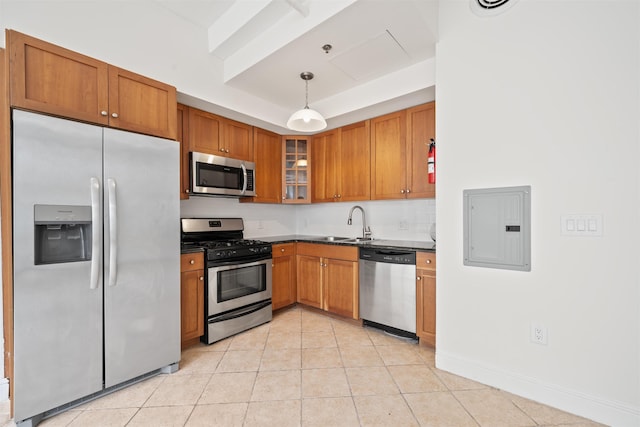 300 Communipaw Ave Unit 11, Jersey City, NJ 07304 - kitchen with appliances with stainless steel finishes, electric panel, dark countertops, brown cabinets, and a sink