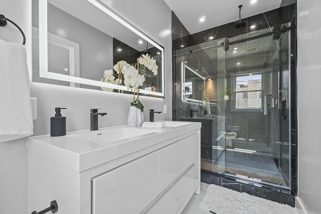 bathroom featuring vanity and walk in shower