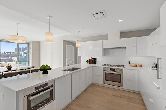 9 Avenue At Port Imperial Unit Ph8, West New York, NJ 07093 - kitchen with modern cabinets, white cabinetry, and recessed lighting