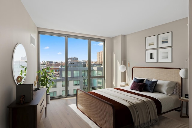 9 Avenue At Port Imperial Unit Ph8, West New York, NJ 07093 - bedroom with light wood-style flooring, access to outside, and a view of city
