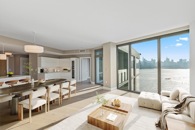 9 Avenue At Port Imperial Unit Ph8, West New York, NJ 07093 - living room featuring a view of skyline and light wood finished floors