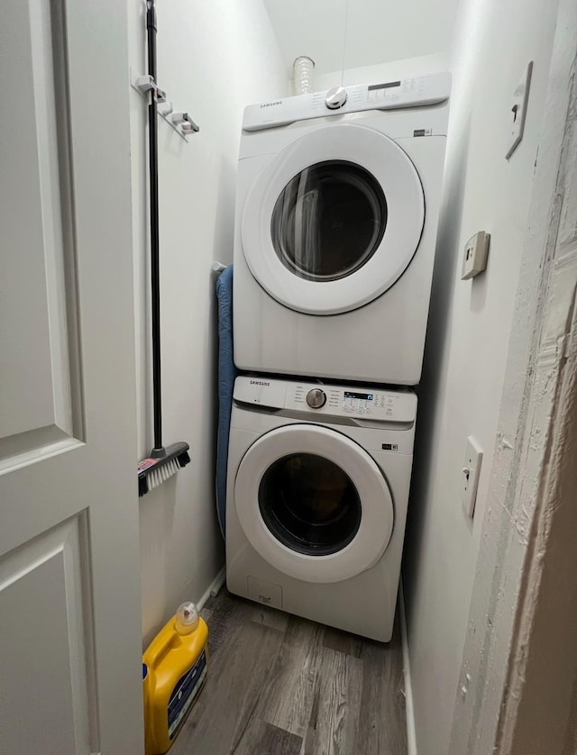 1611 71st St, North Bergen, NJ 07047 - washroom with stacked washer / drying machine and wood finished floors