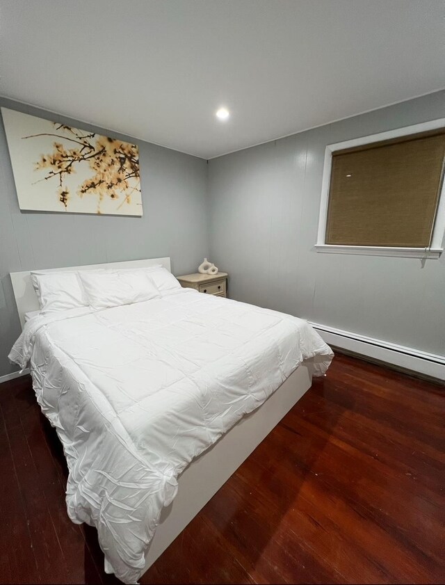 1611 71st St, North Bergen, NJ 07047 - bedroom with hardwood / wood-style flooring, a baseboard heating unit, and recessed lighting