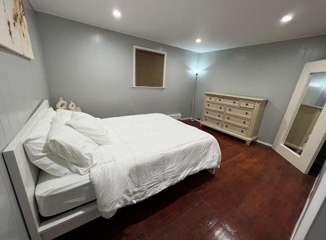 1611 71st St, North Bergen, NJ 07047 - bedroom with wood finished floors, recessed lighting, and a baseboard radiator