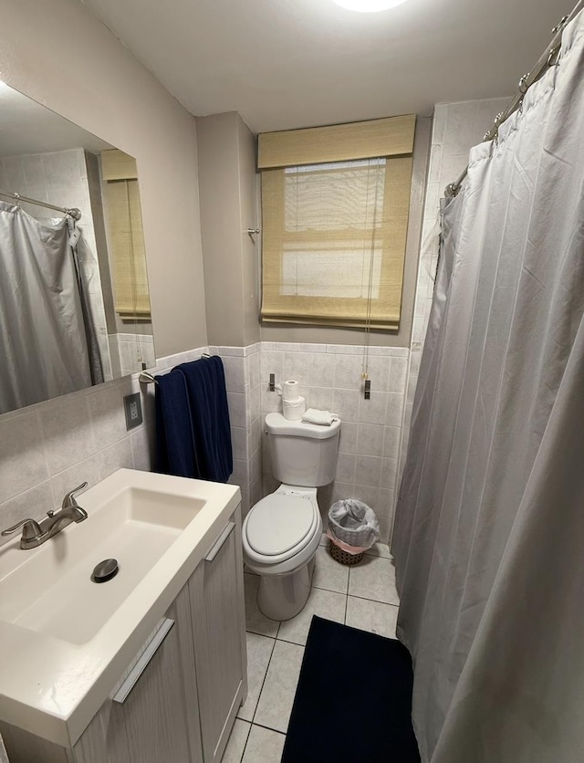 1611 71st St, North Bergen, NJ 07047 - bathroom featuring tile patterned flooring, vanity, and tile walls