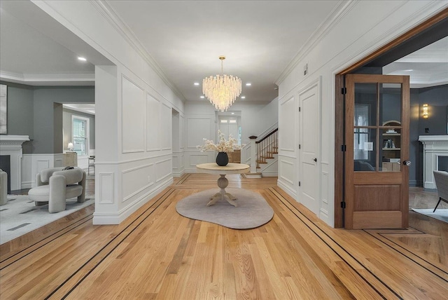 180 Union St, Montclair, NJ 07042 - hall featuring a decorative wall, light wood-type flooring, a chandelier, ornamental molding, and stairway