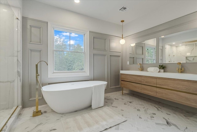 180 Union St, Montclair, NJ 07042 - bathroom with vanity, a soaking tub, plenty of natural light, a marble finish shower, and recessed lighting