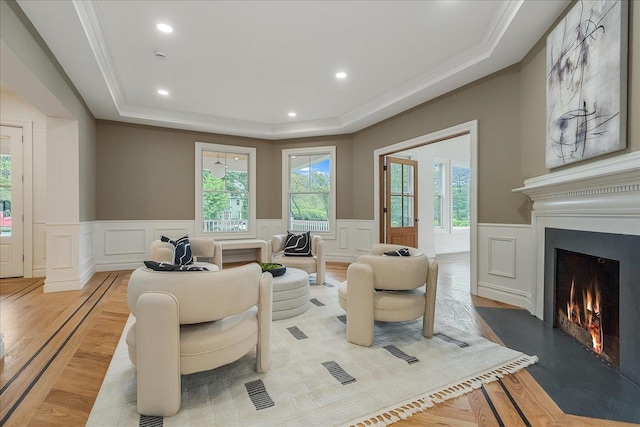 180 Union St, Montclair, NJ 07042 - living area with ornamental molding, a tray ceiling, a large fireplace, wainscoting, and a decorative wall