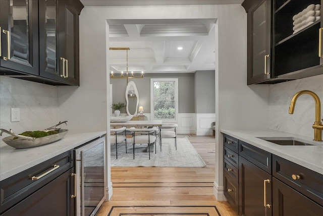 180 Union St, Montclair, NJ 07042 - kitchen featuring beverage cooler, light wood finished floors, coffered ceiling, beam ceiling, and backsplash