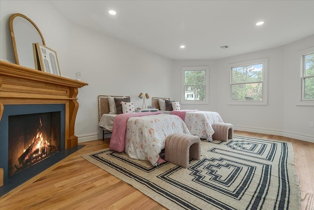 180 Union St, Montclair, NJ 07042 - bedroom with wood finished floors, recessed lighting, and a warm lit fireplace