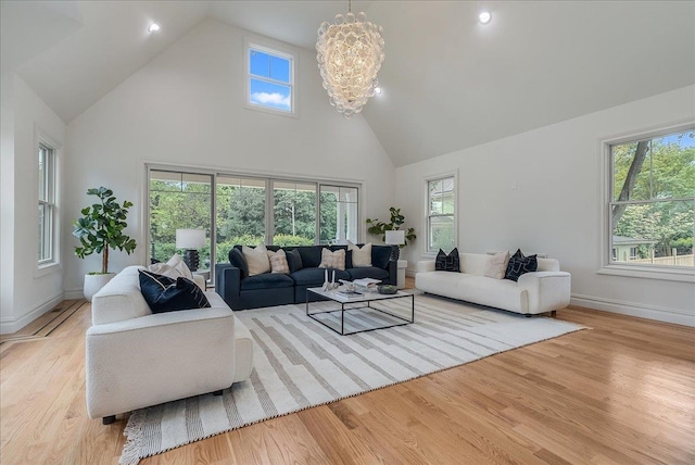 180 Union St, Montclair, NJ 07042 - living room with high vaulted ceiling, plenty of natural light, a chandelier, wood finished floors, and recessed lighting