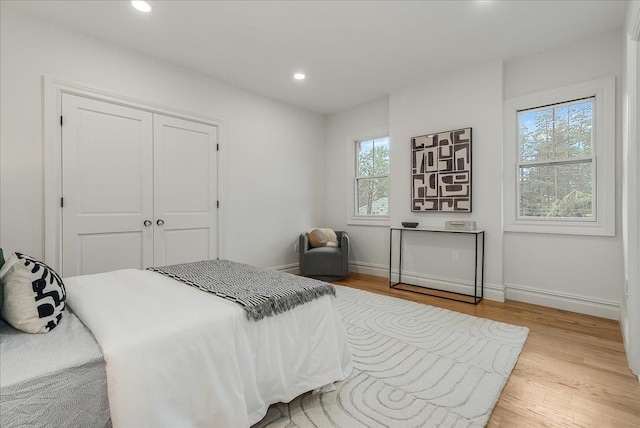 180 Union St, Montclair, NJ 07042 - bedroom with multiple windows, wood finished floors, a closet, and recessed lighting
